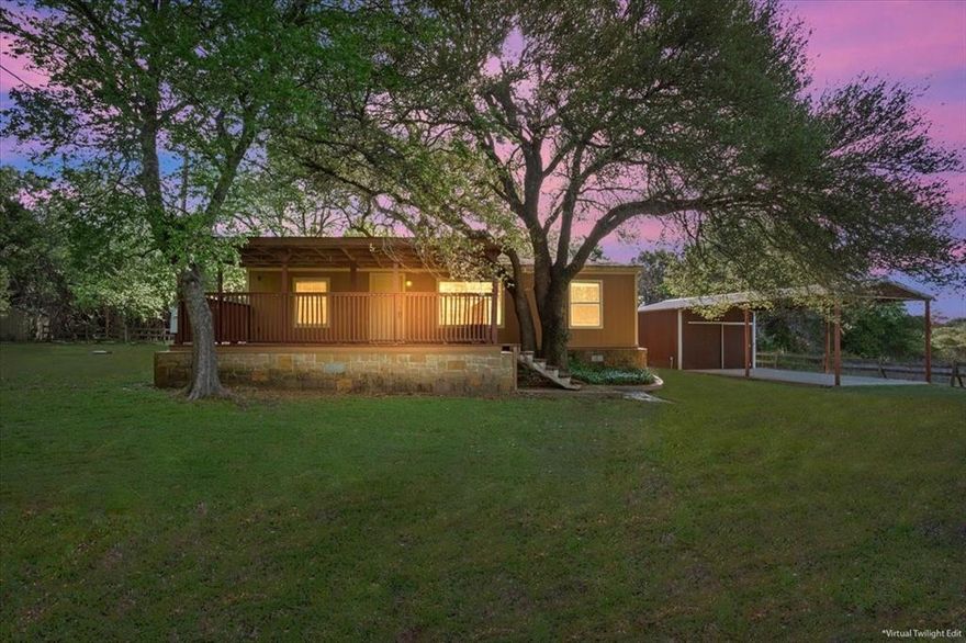 Welcome home to this amazing retreat on 5.02 peaceful acres in the sought after China Spring ISD. Tucked away for privacy, this property is full of charm with beautiful, mature oak trees and a seasonal creek running along the back. The 3 bedroom, 2 bath manufactured home is clean, comfortable, and move-in ready -- featuring pretty wood look vinyl plank flooring, fresh paint, and updated fixtures and counters throughout. There is also a detached covered carport with storage at the back of it, plus there are two other storage buildings for convenience. Start your mornings on the large covered front deck with a cup of coffee, and wind down in the evenings out back where the setting truly shines. A stunning, oversized oak tree provides incredible shade and character, making it the perfect spot to relax or gather with friends and family. There's even a cooking area and firepit ready for weekend gatherings under the open sky. Whether you're dreaming of a quiet homestead, a place to spread out, or somewhere to enjoy the simple things, this property has plenty of room and potential to make it your own!