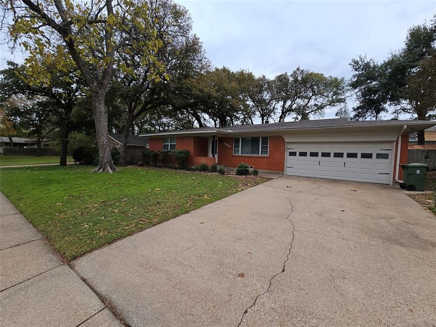 This charming house features 3 bedrooms and 2 bathrooms, providing ample space for comfortable living. Step inside to the beautiful hardwood flooring, laminate, and faux marble tile throughout, giving the home a modern and stylish feel. Spacious backyard is perfect for outdoor activities and comes with a fenced-in pet kennel, allowing your furry friends to roam freely. The house boasts modern fixtures, adding a touch of elegance to every room. With laundry connections conveniently located in the garage.  Situated approximately 1.5 miles away from the Cowboys stadium, sports enthusiasts will love the proximity to game day excitement. Commuting across the DFW metroplex is a breeze with convenient access to either Hwy 30 or Hwy 20. The quartz countertops in the kitchen provide a sleek and durable surface for all your culinary adventures. Don't wait, seize this opportunity to make this house your home and enjoy all the wonderful amenities it has to offer.