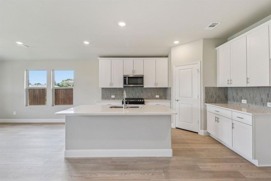 BRAND NEW energy - efficient home Feb 2026! The spacious living area flows seamlessly outdoors to the covered back patio. White cabinets with veined white quartz countertops, tan tone EVP flooring with gray beige tweed carpet. Small-town charm meets modern convenience in Sherman, located 40 miles north of the Dallas metroplex and recognized as one of the best small cities to live in. Westmoor residents will enjoy playgrounds, trail access, and a scenic greenbelt. Groundbreaking energy efficiency is also built seamlessly into every home in this community so you can spend less on utility bills and more on the things that matter most. Each of our homes is built with innovative, energy-efficient features designed to help you enjoy more savings, better health, real comfort and peace of mind.