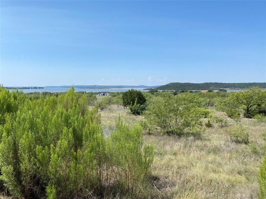 One acre parcel overlooking the waterfront of Possum Kingdom Lake at The Hills. This ready to build on lot has no builder attachment or set time frame to build. Lot ownership permits the use of all neighborhood amenities including; boat storage, boat ramp, community boat dock, cabin and picnic area, clubhouse with pool and fitness center, fishing pond, lake access, and twenty miles of private roads behind the gates. For more info on CCRs and bylaws please visit www.pkhillsassociation.org.