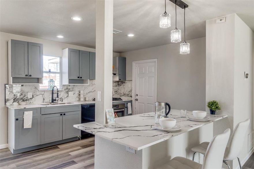 Newly renovated home in the established Forest Grove neighborhood of Dallas, minute from I-30 and 635. This 4 bedrooms, 2 full baths offers a bright open concept living and kitchen space with great natural light. Recently installed vinyl flooring throughout. Fully-reimagined kitchen with updated cabinetry, new quartz countertops, and new appliances including a sleek gas cooktop and stainless hood, a built-in oven, and a dishwasher. Quartz double vanity, fresh tile flooring, and glass showers in the primary ensuite. Bath tub on secondary bathroom. New interior paint, ceiling fans, and LED lighting. Newly installed backyard fence and covered wood patio that provides wonderful shade. Too many upgrades to list! Great Location less than 16 minutes from Downtown Dallas. This move-in-ready home won’t last long!