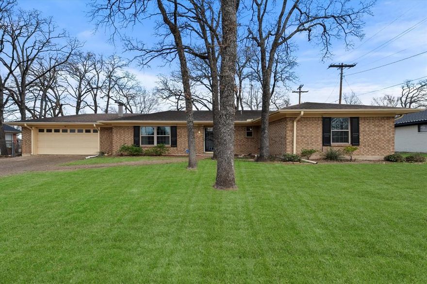 Welcome home to this charming 4-bedroom, 2-bath residence offering 1,787 square feet of comfortable living in the highly sought-after Bowie School District. Nestled in a great neighborhood, this home blends functionality with inviting spaces both inside and out. Step into the living room where a cozy fireplace creates a warm focal point, complemented by tile and wood flooring throughout for easy maintenance and timeless appeal. The kitchen is well-equipped with a double oven, and the adjacent dining room features a convenient pantry, perfect for extra storage and entertaining needs. Just off the dining room, you’ll find a bright sunroom with skylights, a ceiling fan, and a window air conditioning unit, making it an ideal spot to relax year-round. The master bedroom includes two closets and a private ensuite bathroom with a linen closet, offering both comfort and practicality. Outside, enjoy a fenced backyard with a grassy area and mature trees, providing shade, privacy, and plenty of room for outdoor activities. A 2-car garage with an additional storage room adds even more convenience. This well-maintained home offers space, comfort, and a prime location—perfect for those looking to settle into a welcoming community.