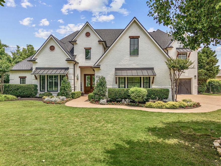 Luxury living at its finest! This exquisitely redesigned home sits on the 12th fairway of Timarron Country Club within one of Southlake's most sought-after neighborhoods. The reimagined exterior wows with modern painted brick, mahogany double doors and lush landscaping. The curb appeal invites you in to find sophisticated designer details throughout; white oak floors, dramatic staircase, modern fireplaces, statement lighting and open-concept living spaces flooded with natural light and breathtaking views. The showpiece kitchen, boasting a 10' white oak island with waterfall quartzite, 48in range, custom cabinetry, spacious pantry and dry bar, seamlessly opens to the great room, outdoor living and backyard oasis for all-season entertainment. Primary suite is a retreat with remodeled spa-inspired bath. The flexible floor plan offers an impressive executive office, 3 beds and game room up. 300sqft of attic space easily becomes a 5th bed, media, or gym. A MUST-SEE in acclaimed Carroll ISD!