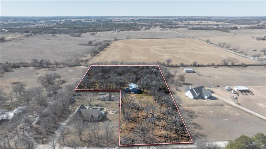 Escape to this peaceful, 2.43-acre rural retreat where the possibilities are endless. Unrestricted Acres with Utilities 
Priced under its recent appraisal, this 2.43-acre Hood County parcel is ready for your custom build or barndominium! Located in the quiet Lail Addition, this build-ready lot features a water well and electricity already on-site. To be fully operational, the well will require a new pressure tank, and the existing septic system is currently non-functional. These minor infrastructure updates allow you to customize the systems to your specific needs. Includes a cleared homesite and a spacious 2-car shop with an attached carport for RV storage. No HOA just minutes from Lake Granbury!