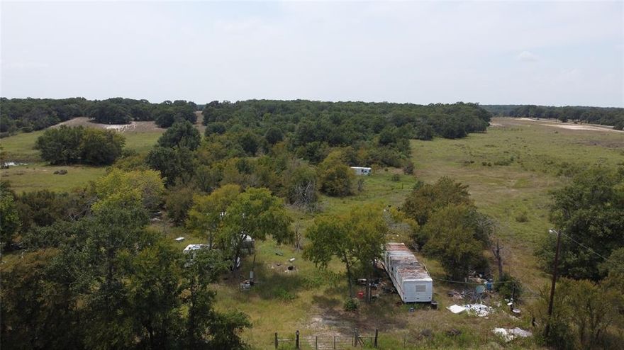 Welcome to you little slice of Texas! This wooded 5 acre tract is located in the country east of Groesbeck! The entire property is fenced, and there is a good sized tank as well.  There is also a water well, so no city water bills! With a little bit of work this spot can be your dream location! It is kind of hard to find with google, so just know that it is 3 miles north of the intersection of 164 and 39.