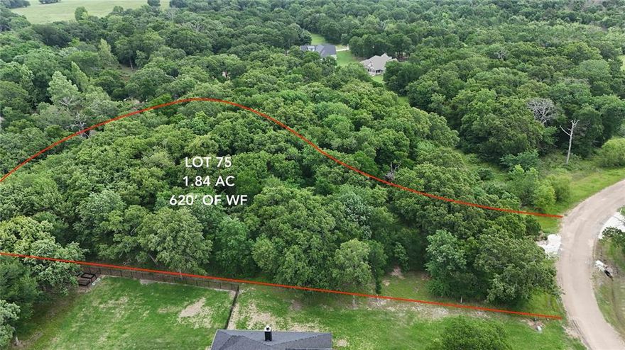 One of the most impressive lots in Oakmont, this 1.84-acre property boasts approximately 620 feet of platted water frontage, offering an incredibly private, wooded setting in a gated lakeside community. Enjoy tranquil surroundings with access to community amenities including a pavilion, fire pit, and picnic area. Underground utilities and high-speed internet available.
 Restricted to site-built homes with a minimum of 1,800 sq ft HVAC living space and a 2-car attached garage. Guest homes allowed with Architectural Committee approval and matching exterior design. Setbacks: 75' front, 20' side, 25' rear. Fences allowed with approval. Must comply with Mabank building codes; some lots may require variances.