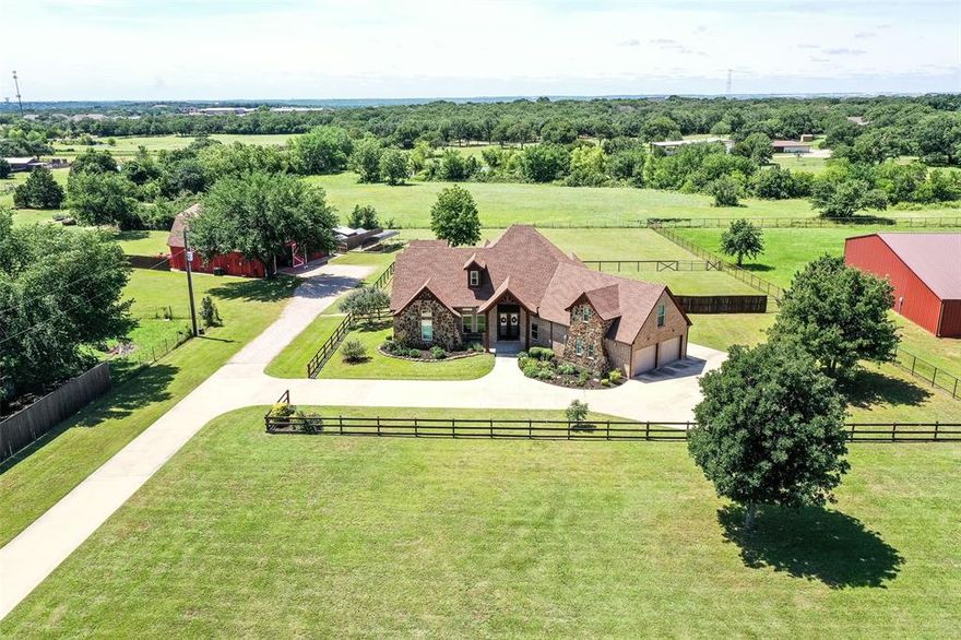 Private 3-Acre Estate in Argyle – Custom Home, Barn, and Guest Quarters!
Nestled on nearly 3 acres and set back from the road for ultimate privacy, this phenomenal north-facing, two-story custom home combines timeless craftsmanship with modern luxury. Surrounded by mature trees and beautifully maintained grounds, it offers serene living and breathtaking sunset views from the expansive back patio. Built with durable 2x6 construction, every detail of this residence reflects quality, comfort, and sophistication.
Inside, the home features 4 spacious bedrooms and 4 full baths, providing generous accommodations for family and guests. The thoughtfully designed layout blends classic architectural elements with contemporary touches throughout. The gourmet kitchen is a chef’s dream—complete with stainless steel appliances, custom cabinetry, and expansive countertops ideal for meal prep and entertaining. The open living and dining areas create a welcoming flow, while flexible spaces easily adapt for a home theater, office, or playroom.
The luxurious primary suite serves as a private retreat with a spa-inspired ensuite bath, dual walk-in closets, and sweeping views of the peaceful landscape. Every room has been designed for comfort, function, and connection to the property’s natural surroundings.
Outside, enjoy multiple patios perfect for relaxing or hosting under the trees. The grounds are meticulously landscaped, offering ample room for recreation, gardening, or simply enjoying nature. The impressive gambrel-style barn includes garage space for up to four vehicles, a private gym area, and a fully equipped accessory dwelling unit (ADU) ideal for guests, extended family, or a home office. A sustainable chicken coop and rainwater harvesting system add to the property’s self-sufficient appeal.
This extraordinary estate delivers an unmatched blend of privacy, luxury, and versatility—an exceptional opportunity to own a one-of-a-kind property in sought-after Argyle.