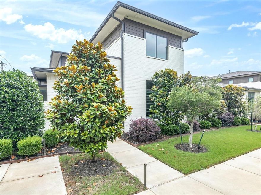 Located in Fort Worth's highly sought after River District and offering modern, contemporary living is this home located on a corner lot in The Grove. This exceptional 3,3.5 property has an open concept living area with a large covered patio for easy access and entertaining. The kitchen has a large island with recessed and pendant lighting plus a five burner gas cooktop. There are an abundance of cabinets with glass fronts and built-ins in the dining area. The living area of the home has engineered wood with a gas log fireplace and unique chandelier. The wood flooring continues into the primary suite and there is neutral paint throughout. The primary bath has dual sinks, garden tub and separate shower with marble look tile floors and surround with a large walk-in closet. Upstairs is a second living area game room with two additional bedrooms with walk-in closets, each with its own bathroom! The patio on this corner lot is oversized and has patterned tile flooring and turf for maintenance free outdoor living. There is an alleyway, rear entry two-car garage with painted epoxy flooring. HVAC system replaced in 2024! Minutes to scenic recreational trails and moments to Fort Worth's premier dining, shopping and cultural hotspots.