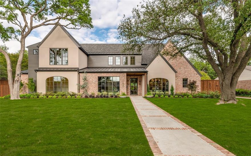 Situated on a beautifully landscaped lot, this brand new, exceptionally built custom residence by Montgomery Custom Homes offers a refined blend of timeless design, elevated craftsmanship, and modern livability. The home features 5 bedrooms, including a luxurious primary suite and private guest suite on the first floor.
Designed for both everyday living and entertaining, the home includes a formal dining room, a private study downstairs, and a custom upholstered breakfast nook. The open-concept kitchen is outfitted with Thermador appliances, Mont Blanc quartzite countertops, a Venetian plaster vent hood, and a built-in bar with beverage drawers and an ice maker.
Upstairs, a spacious game room is complemented by an additional sitting area ideal for a secondary lounge, TV room, or study space.
Built with a focus on quality and efficiency, the home features full open-cell foam encapsulation, Level 4 smooth sheetrock, Lincoln windows, and three zoned Carrier HVAC systems. Two Navien tankless water heaters with recirculation provide added comfort.
Living spaces are anchored by two masonry fireplaces, including a carved limestone surround, while thoughtful conveniences such as three washer dryer areas (including one in the primary closet), landscape lighting, and holiday lighting outlets enhance everyday living.
Outdoor living is equally impressive, featuring a resort-style pool and spa, fully turfed backyard with irrigation, and a covered patio with screens, tile flooring, and a fully equipped outdoor kitchen with grill, vent hood, and refrigerator.
The gated driveway leads to a two-car attached garage and a detached, climate-controlled single-car garage with a dedicated pool bath—offering flexibility for additional storage, fitness, or hobby space.
A rare opportunity to own a truly custom, thoughtfully designed home in a highly desirable Dallas location.
