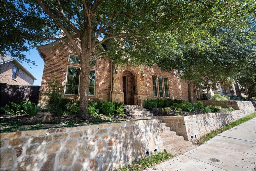 This beautiful, meticulously maintained home features so many updates!  
Located in the prestigious, gated Reserve community within the award-winning Castle Hills development, this area is highly sought for its proximity and convenient access throughout DFW. 
Step inside to a thoughtfully laid out floor plan with flexibility to meet a myriad of living options.  
The open living-kitchen area is the heart of the home with a beautiful stone, gas fireplace.  Enjoy making memories and meals in the kitchen that is truly a chef's dream with numerous upgrades including new appliances and added cooking capacity with an additional double oven, gas range. A cheerful breakfast nook with a window seat provides a casual, cozy spot to keep company while you cook. A dedicated home office makes working from home a pleasure.  The primary bedroom is on the main floor, providing a peaceful, private sanctuary.  Upstairs you'll find a large game room offering options for entertaining and relaxing.  Three additional, spacious bedrooms and 2 full bathrooms are also upstairs.  One of the three bedrooms is a full ensuite, and one is ideally designed to be a flexible space wired with surround sound that could serve as a media room, hobby space or home gym.  The backyard has been completely redone with landscaping and beautiful stone walkways.  A covered patio with gas plumbing creates an outdoor haven.  Enjoy a maintenance free home with The Reserve HOA providing fully tended front yards, and its own private community pool, clubhouse, and fitness center.  Make the most of Castle Hill's amenity-rich community featuring numerous pools, championship golf course, community centers, sport courts, parks, trails, shops, dining and highly rated Lewisville schools. Come see for yourself what makes this home and community so special!