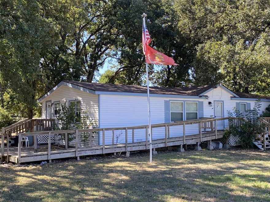 MULTIPLE OFFERS RECEIVED, DEADLINE TO SUBMIT AN OFFER is 12-5-2025 at 3pm. Spacious country living with room for everything! This well-maintained mobile home sits on a full 1-acre lot featuring a 3-car garage, RV access, and two large storage units (12x11 and 13x12). Inside, you’ll find double-pane windows, hardwood flooring, new carpet in the bedrooms and walnut kitchen cabinets. PVC has been replaced with copper plumbing and concrete footing has been installed around the home in 2024. The second bathroom offers a relaxing jacuzzi tub, while the roof was replaced just 3 years ago. A 1,000-gallon septic tank installed in 2024 adds peace of mind.