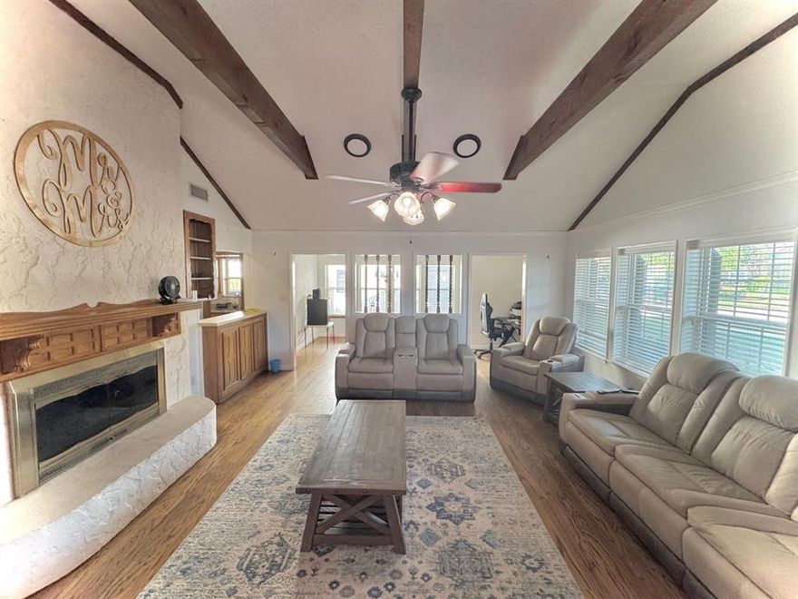 Beautifully maintained 3-bedroom, 2-bath home in a desirable, established neighborhood near schools and parks. Spacious living room features a cozy wood-burning fireplace and built-in bar, perfect for entertaining. Primary suite offers an en-suite bath with separate shower, double vanity, and large walk-in closet. Oversized garage plus extended driveway with parking for 4+ vehicles. Recent upgrades include new roof, grounded electrical panel, LED lighting, enhanced insulation with solar fan, and security system wiring. Yard includes French drain and new sprinkler heads for easy maintenance. Ample storage throughout. Washer, dryer, refrigerator, and dog house may convey. Seller concessions available. Buyer-Buyer’s agent to verify all information.