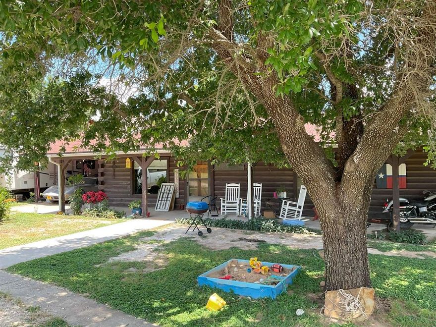 19.68 Acres with a Charming 3-Bedroom home – Peaceful, Private, and Full of Potential. The home sits well off the road, offering peace, privacy, and a large open area in front, perfect for enjoying the quiet country life. Inside, you'll find durable concrete flooring throughout, with vinyl in the utility room and tile in the primary bathroom. The open-concept layout features a spacious kitchen with a large island, complete with a breakfast bar and an electric cooktop. There’s ample cabinetry and a generous dining area for hosting family or guests.  The living room centers around a striking rock, a wood-burning fireplace, adding warmth and rustic charm. All three bedrooms are comfortably sized and offer plenty of space.  Behind the home, the acreage transitions into a mix of open pasture, rolling hills, rocky terrain, and valleys—ideal for grazing cattle, recreational use, or hunting deer and other wildlife. Buyers should verify the Schools and all other information.