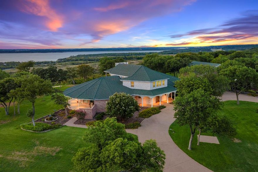 Come and EXPERIENCE a multimillion-dollar VIEW! The view from this estate surpasses the panoramic view from the penthouse of a 25-story building. Attributes of this estate property: 1.Truly captivating PANORAMIC view 2.Amazing lake view 3.View of the city skylines of DFW metroplex 4.View of a million city lights shinning like diamonds at night 5.View of magnificent sunsets reflecting across the lake 6.The safety of 2 gates in an outstanding gated community 7.Privacy and security of a hilltop retreat 8.View across a permanent large natural greenbelt 9. Feeling of being in nature in a park-like setting without traffic noise. 10.Ample land for outdoor activities like tennis, volleyball, swimming, gardening + more. 11.Cool hilltop summer breezes. 12.Stable soil for a good foundation 13.Close to great shopping 14.Easy access to downtown Dallas & airports. The Frank Lloyd Wright-inspired home w-an 8-car garage, has an intriguing design & construction details maximizes the amazing view. Please see the attachmets for some additional property information.