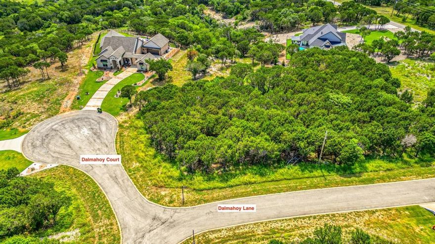 This Beautiful Corner Lot Sits on a Cul-De-Sac with Many Beautiful Trees Atop One of the Many Rolling Hills, Making it a Truly Tranquil and Picturesque Setting. The Retreat, Located 30-minutes South of Downtown Fort Worth Offers a Perfect Setting to Build Your Dream Home With NO Timeline to Build! In Addition to the Natural Beauty, The Retreat offers Great Amenities for You to Enjoy. The Championship 18-Hole Golf Course is Perfect for Those Who Love Golf or Simply Appreciate a Well-Designed Course. You Can Also Take Advantage of the Community Clubhouse, On-Site Restaurant and Bar, Two Swimming Pools, Fitness Center, Hiking Trails, and Tennis Courts to Relax and Have Fun. Don't Miss Out on the Chance to Experience the Peacefulness of this Community and the Amazing Lifestyle it Offers.