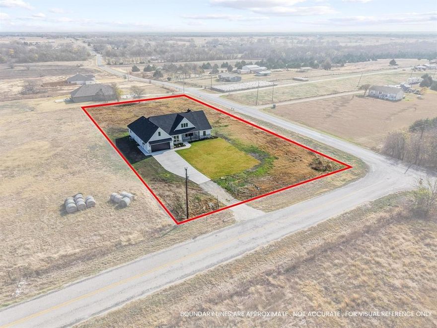 Welcome to this impeccable new construction home, a true testament to high-quality craftsmanship, located in Collin County & sought-after Blue Ridge ISD. Fall in love with this 1+ acre corner lot and the striking curb appeal of this contemporary craftsman, offering both space and privacy, with plenty of room to add a shop or a pool. The crisp, stark white board and batten siding and elegant brick exterior create a captivating contrast, accented by sophisticated rich black lighting & dramatic overhangs. This home is a true showstopper! Designed for a comfortable lifestyle, this unforgettable home boasts high-quality finishes and an open floor plan that is flooded with natural light. An airy & open ambiance is created by the expansive cathedral ceiling complemented by handsome wood beams. Enjoy the warmth and ambiance of the prominent fireplace (wood burning with propane starter). The heart of the home, this chef's kitchen is an entertainer's dream. Enjoy abundant storage with floor-to-ceiling soft close cabinetry, and a stunning, high-contrast island that serves as the perfect gathering spot. Kitchen flows seamlessly into the casual dining area. The backsplash is a work of art adding a bold contrast to the countertops. Primary BR showcases an incredible ensuite with dual vanities, soaking tub & a walk in shower that is magazine worthy. The home includes two additional bedrooms, another 1.5 bathrooms, versatile flex-office space, & large laundry room designed with added safe-space features in mind. Step outside to an expansive patio—perfect for entertaining or simply relaxing under those bright, starlit Texas nights. The home is generator-ready with electrical already installed & features a three-car tandem garage. This quality home is filled with desirable features & scenic views you’ll want to experience firsthand. Its exceptional location offers the perfect blend of country charm & everyday convenience.