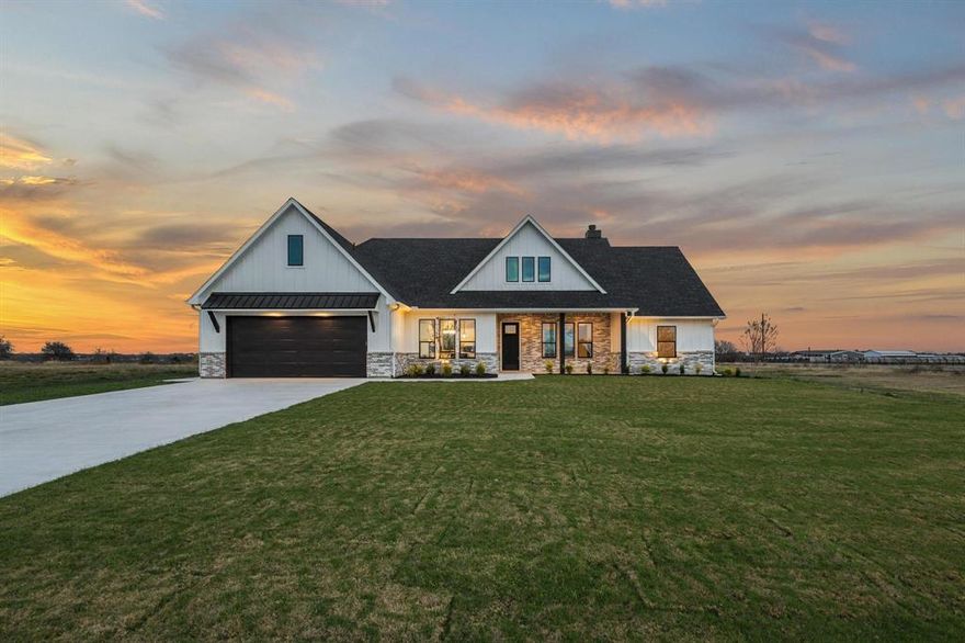 Welcome to this impeccable new construction home, a true testament to high-quality craftsmanship, located in Collin County & sought-after Blue Ridge ISD. Fall in love with this 1+ acre corner lot and the striking curb appeal of this contemporary craftsman, offering both space and privacy, with plenty of room to add a shop or a pool. The crisp, stark white board and batten siding and elegant brick exterior create a captivating contrast, accented by sophisticated rich black lighting & dramatic overhangs. This home is a true showstopper! Designed for a comfortable lifestyle, this unforgettable home boasts high-quality finishes and an open floor plan that is flooded with natural light. An airy & open ambiance is created by the expansive cathedral ceiling complemented by handsome wood beams. Enjoy the warmth and ambiance of the prominent fireplace (wood burning with propane starter). The heart of the home, this chef's kitchen is an entertainer's dream. Enjoy abundant storage with floor-to-ceiling soft close cabinetry, and a stunning, high-contrast island that serves as the perfect gathering spot. Kitchen flows seamlessly into the casual dining area. The backsplash is a work of art adding a bold contrast to the countertops. Primary BR showcases an incredible ensuite with dual vanities, soaking tub & a walk in shower that is magazine worthy. The home includes two additional bedrooms, another 1.5 bathrooms, versatile flex-office space, & large laundry room designed with added safe-space features in mind. Step outside to an expansive patio—perfect for entertaining or simply relaxing under those bright, starlit Texas nights. The home is generator-ready with electrical already installed & features a three-car tandem garage. This quality home is filled with desirable features & scenic views you’ll want to experience firsthand. Its exceptional location offers the perfect blend of country charm & everyday convenience.