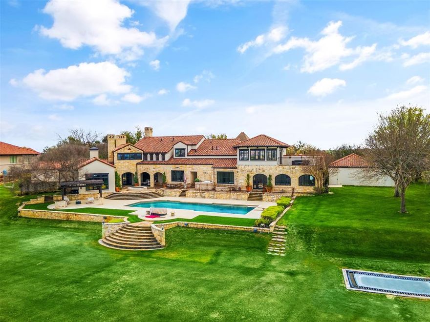 Experience unparalleled luxury in this Italian Villa nestled on 3.25 acres within Fort Worth's prestigious Montserrat community. Admire breathtaking views and sunsets from every angle. With five bedrooms, a media room, gym, private office, and five living areas, this home offers space and elegance. Enjoy the expansive primary suite featuring his & her walk-in closets, a four-car garage, basketball court, an oversized pool, and an outdoor kitchen, making it an entertainer's dream. Welcome to a lifestyle of opulence and sophistication.