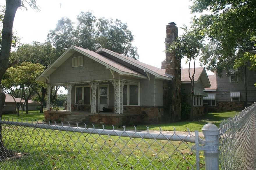 Large 2 story farmhouse featuring wood floors, native stone, 2 stone fireplaces, large windows, period iron work on front porch. New flooring in upstairs bath, downstairs bath features a marble shower and quartz counter tops. Kitchen features lots of cabinet space, cook top, double oven. Large fenced yard, oversized garage. Newer ceiling fans in some rooms. Photos show older ceiling fans. Tenant is leasing and only responsible for the fenced in area surrounding the house.