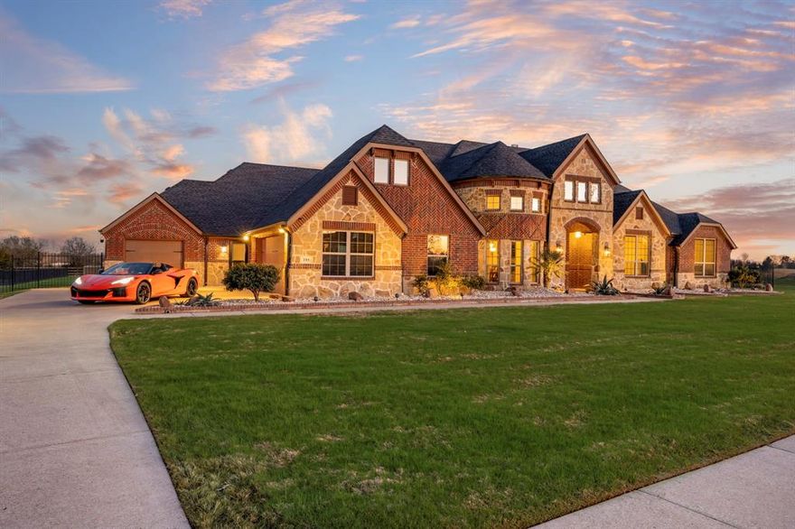 Luxury living meets the laid-back lake lifestyle just minutes from Lake Ray Hubbard.
Imagine starting your mornings with a walk along the water, afternoons on the boat, and evenings relaxing in your own private backyard retreat. Located in one of Rockwall County's most desirable areas, this home offers not just space, but a lifestyle.
Step outside and you’ll find a resort-style backyard designed for year-round enjoyment. The sparkling pool and hot tub are perfectly positioned for entertaining or unwinding after a long day. A spacious screened-in outdoor living area features an outdoor kitchen, fireplace, and ample seating space, ideal for game days, family gatherings, or quiet evenings by the fire. 
Inside, soaring ceilings and abundant natural light create an impressive yet inviting atmosphere. The spacious living and dining rooms flow seamlessly, highlighted by rich wood floors that continue into the game room and private office. The chef’s kitchen is the heart of the home, showcasing a massive island perfect for entertaining, a walk-in pantry, and generous prep space.
This thoughtfully designed floorplan includes 4 bedrooms, 3.5 bathrooms, a dedicated office, game room, home theater, and flex space currently used as a workout room.
The primary suite is a true retreat, featuring direct access to the backyard. Step straight out to your hot tub and pool for a late-night soak or peaceful morning start.
Additional highlights include remote temperatures control in the 2-car garage, transfer switch for whole home generator, and a third garage bay perfect for storing your lawn mower and recreational toys.
With its proximity to the lake, vibrant dining and shopping, and easy access to major commuting routes into Dallas, this home offers the perfect blend of luxury, functionality, and the elevated Rockwall lifestyle.
Experience everyday living that feels like a vacation, right here in Rockwall.