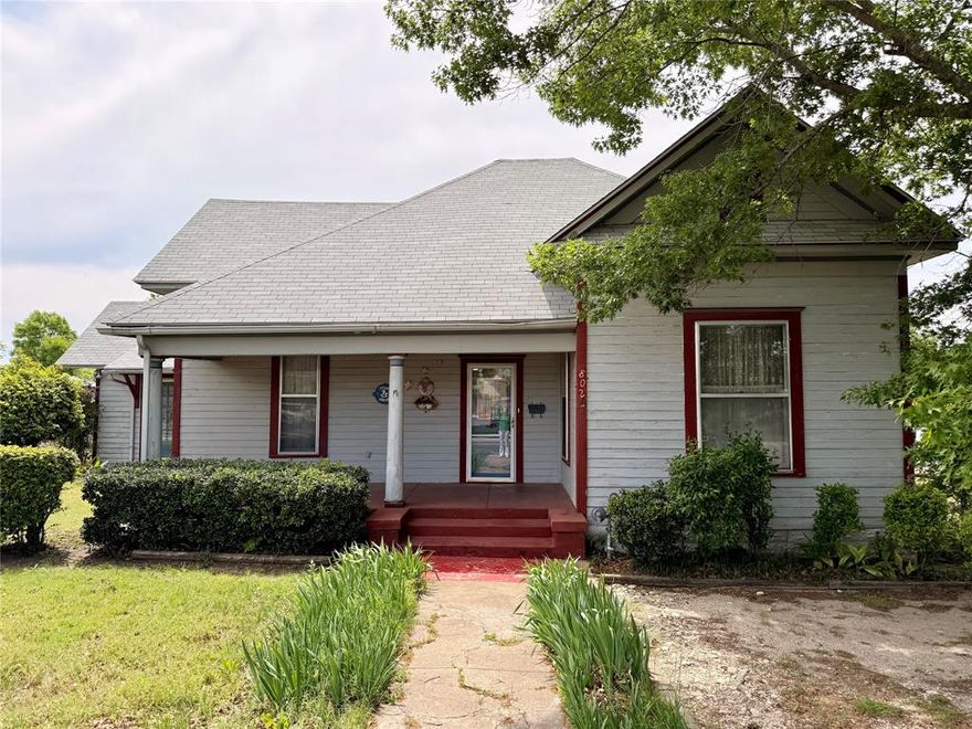 This well-built 1930s home has been lovingly cared for, with its original character preserved throughout, including beautiful door and window framing woodwork. The home offers 3 bedrooms, 2 baths, a well-designed layout, and important updates such as a new roof (spring 2025), an updated central heat and air system, and a recent water heater. Zoned commercial with residential use permitted as well, this property offers excellent flexibility for a variety of uses.

Enjoy everyday convenience with close proximity to the hospital, grocery store, farmers market, and local dining. Side-street parking, a covered carport, and a circle drive make access effortless. The fully fenced backyard features his-and-her sheds, ideal for hobbies or storage, along with mature trees that showcase stunning seasonal color. A delightful sun porch provides a cozy spot to relax year-round.

Full of charm, comfort, and practical updates, this home is a true Hamilton gem.

SELLER CONCESSION AVAILABLE – USE FOR A FRESHLY PAINTED EXTERIOR OR AN INTEREST RATE BUYDOWN – BUYER’S CHOICE!