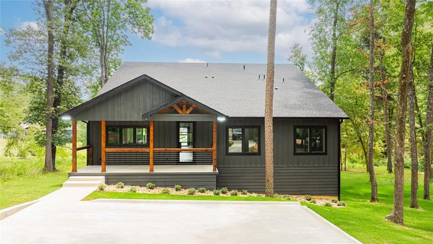 Stunning New Build in The Oaks at Lake Cypress Springs!! Finding a brand new build on this lake is extremely rare. This 2025, custom 4 bedroom, 3 bath home is thoughtfully designed with modern conveniences throughout, situated on a generous 1.93 acre lot with serene lake views. Inside, you’ll find a spacious walk in kitchen featuring stunning granite island and counters, top of the line appliances, a walk in pantry with butcher block countertops, and upscale dual color cabinetry adding contract and sophistication.  The living space features a modern wet bar offering a stylish touch for hosting, while the open layout flows effortlessly into a large walkout patio complete with a striking stone fireplace.
Each bathroom is a showpiece, boasting designer tile combinations that elevate the overall aesthetic and add a custom flair to every space. The master suite is a private retreat, featuring expansive sliding glass doors that open directly to the patio, inviting in natural light and lake breezes.
A HUGE bonus is the lake level flex room underneath the home with two garage doors making it ideal for a game room, bunk space, or a luxury storage for lake toys. A new retaining wall adds long-term value and structural peace of mind and plenty of shoreline to build a new boathouse.
Don't miss the opportunity to own this BRAND NEW, completely warrantied, exceptional full time residence or luxury weekend escape with it's very own Generac!