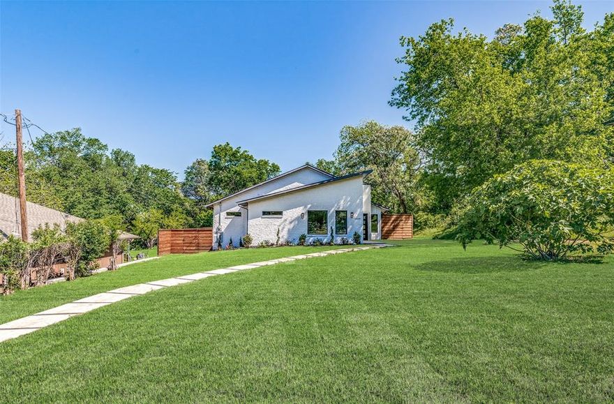 New modern look on this beautifully updated home.  Frame up remodel includes new electric, plumbing, central heat & air, sheetrock, insulation, windows, paint, flooring, kitchen, and baths.  Your clients will love the new open floor plan that features huge kitchen, living, and dining room.  Master bath features standalone tub and walk in shower.  Vaulted ceiling in master.  Huge island in kitchen with quartz counters and stainless-steel appliances.  Oak hardwood throughout home except in wet areas which have new ceramic tile.  Home sits on almost a half-acre which includes new sprinkle system.  Plenty of room for the kids to play and to entertain guests.  Rear entry garage with gate for security.  Plenty of storage space.