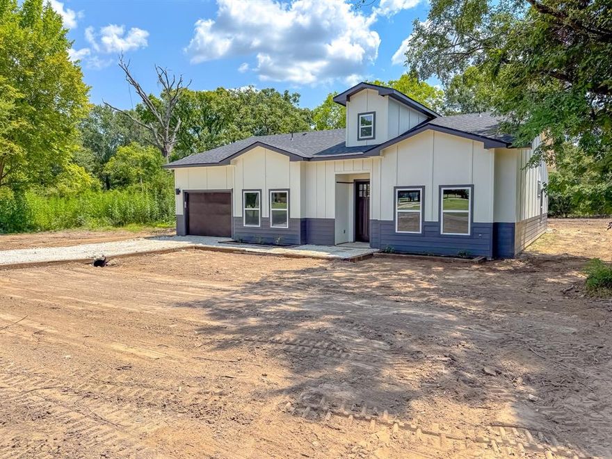 Located just outside city limits in Freestone County, this beautifully built new construction home offers comfort, style, and space on a generous half acre lot with quick access to I-45 and town conveniences. This spacious 3 bedroom, 2 bathroom home features high ceilings and an open concept layout that seamlessly connects the living, dining, and kitchen areas. The kitchen is equipped with a large center island, ideal for both everyday use and entertaining. Each bedroom includes a walk in closet, and the home also offers a flexible bonus room that can be used as a home office, guest room, or playroom. The primary suite features a large soaking tub and a separate walk-in-shower for added convenience. With its peaceful setting just outside city limits and close proximity to shops, dining, and local conveniences in town, this home offers the best of both comfort and location. Whether you're looking for space, style, or everyday functionality, this new construction in fairfield checks all the boxes! FREE appliances with the home!