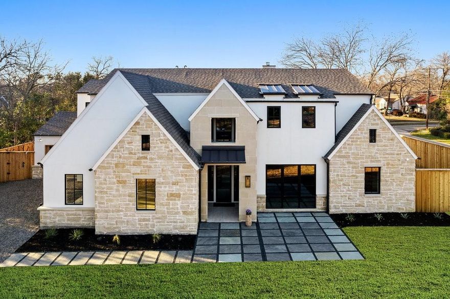 Welcome to a masterpiece of modern elegance – a French farmhouse-inspired stucco residence adorned with timeless stone accents & neutral trim. As you step through the entrance, a grand chandelier illuminates the foyer, setting the tone for the refined beauty that lies within.Coach lights guide the way to the impressive 3-car garage on this sprawling 0.46-acre property.The heart of this home is a culinary delight, featuring a stunning La Cornue range, Roman clay vent hood, brass light fixtures, stained island, marble countertops, and backsplash with an integrated shelf. Brass hardware and faucet accentuate the sleek design. Additionally, this property boasts a pool bath for added convenience, as well as a prep kitchen & a flex space for versatile use.Other notable features include a tongue and groove office ceiling, bead board laundry room & a custom wine room.This property marries contemporary design with classic elements, creating a home that is both sophisticated and welcoming.