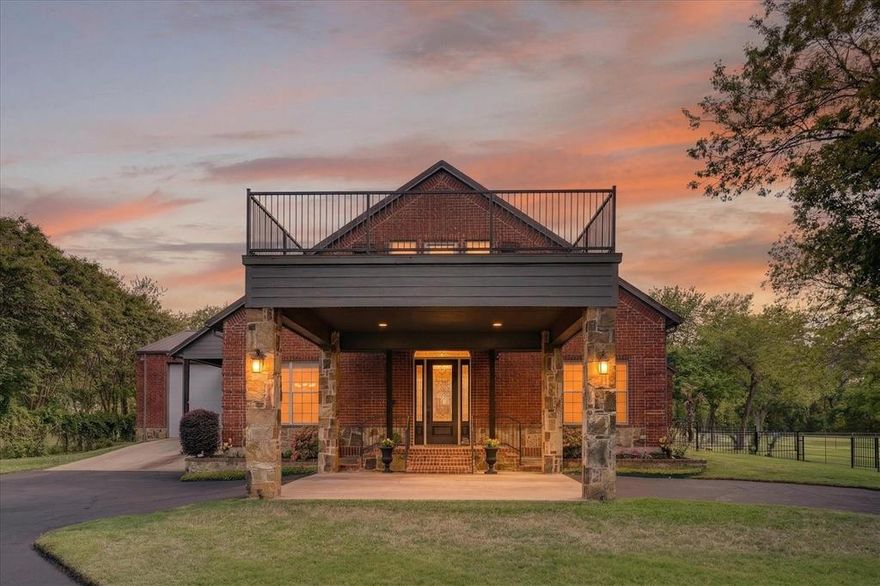 Tucked away on 5.09 gated acres in a highly desirable location just minutes from the city, this exceptional custom-built estate offers the perfect blend of privacy, space & refined country living. With approximately 3,662 square feet, this beautifully maintained home is designed for both everyday comfort & effortless entertaining. Gated entrance, circle drive, & impressive porte-cochère create a grand first impression, centered around a magnificent pre-Civil War pecan tree that brings timeless charm & character. Inside, you are welcomed by spacious living area filled with natural light & a cozy gas fireplace. Windows with power shades add both comfort & convenience. The open dining area flows seamlessly into the well-appointed kitchen featuring granite countertops, striking herringbone backsplash, built-in wine rack, & large pantry—perfectly blending style & function.A true showstopper, an expansive 840 sq ft media & entertainment room is ideal for hosting unforgettable gatherings,with direct access to the back patio. Private primary suite is a peaceful retreat,with patio access & spa-like ensuite with soaking tub,walk-in shower, & oversized closet with custom built-ins.Upstairs,you’ll find additional bedroom, full bath, & loft-style gameroom or office overlooking the main space, with private terrace perfect for morning coffee or evening sunsets. Downstairs on the composite large deck enjoy a tranquil, pool-size tri-level waterfall feature with recirculating pump—designed to attract nature & create your own private oasis. Property is cross-fenced with no-climb wire & includes a catch pen & loading chute for added versatility. Additional highlights include 900 sq ft insulated garage-workshop with 21-ft ceilings ideal for RV parking, a 1,200 sq ft metal building with electricity, & 22kW Generac whole-home generator. A rare opportunity to own a secluded retreat with upscale amenities & unforgettable charm—just minutes from city conveniences.