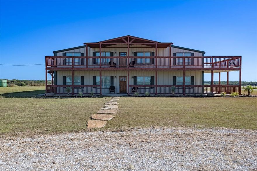 Endless possibilities await at 501 Anderson Ranch Road, situated 30 minutes South of Dallas-Fort Worth! A rare find in Ellis County! Nestled on +or-120 gorgeous acres in Waxahachie, this custom barndominium offers the perfect setup for ranch life and so much more. Whether you're dreaming of a working cattle ranch, a serene family compound, a weekend lodge, or even an Airbnb-style retreat—this one-of-a-kind property is ready to deliver. A setup that has been thoughtfully designed with both comfort and utility in mind, the land is fully fenced and cattle-ready with excellent grazing, and natural water sources. Enjoy mornings on the porches and evenings watching the sunset over the wide open spaces. You’ll also enjoy quiet privacy, star-filled skies, and plenty of space to roam or ride.  Inside, you’ll find warm custom finishes, private suites, open areas for entertaining, and the perfect blend of rustic charm and modern touches. Pictures simply don't do it justice! Designed with flexibility in mind, the home features two primary suites and two full kitchens, making it ideal for multi-generational living or hosting guests. Whether you're raising a family, managing livestock, or simply looking for your forever escape—this property is the real deal, the incredible ranch lifestyle that offers it all! Seller may be open to selling less land if the buyer desires, ask agent.