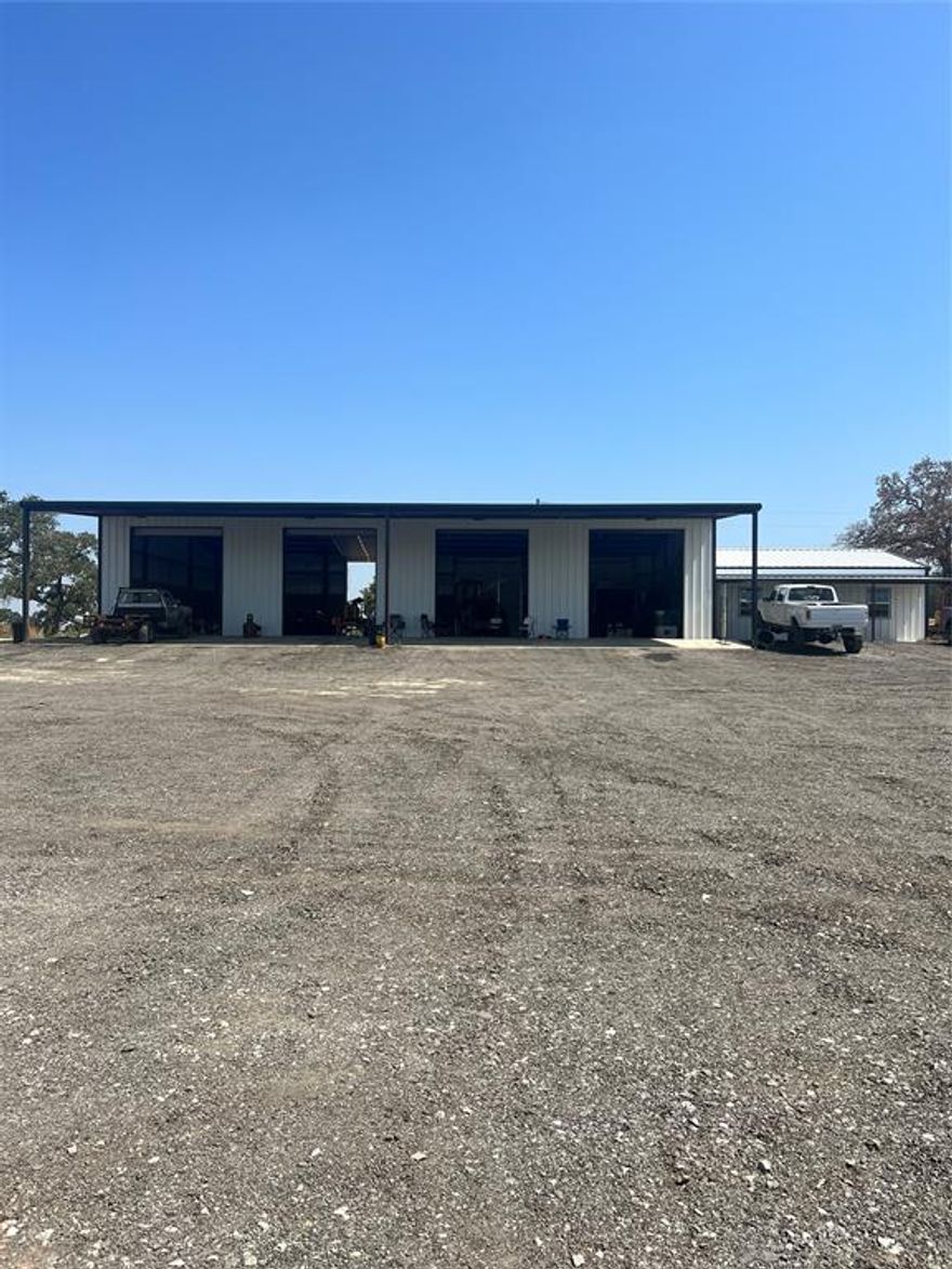This Property is in a Prime location for a commercial business or anything that can be thought of because this property is not zoned. There is a brand new 50X60 metal building with 4 12X16 roll up doors, 3 which are drive through bays. There is 20ft awning that comes out in front of shop. 20ft concrete wash pad attached to the west of the building. There is electric and water to shop and air ran to all 4 corners of shop, also an individual bathroom for the shop area. Attached to the shop with an entry & exit door is a 30X40 office with 2 office rooms, bathroom, conference room, and break room. The office is not finished out but is in the process of being built out, will be spray foamed. Majority of property has brand new top rail no climb fence.
There is another building on east side of property that is used for storage it is approximately 60x80.
There is also 5 RV Hookups at back of property.