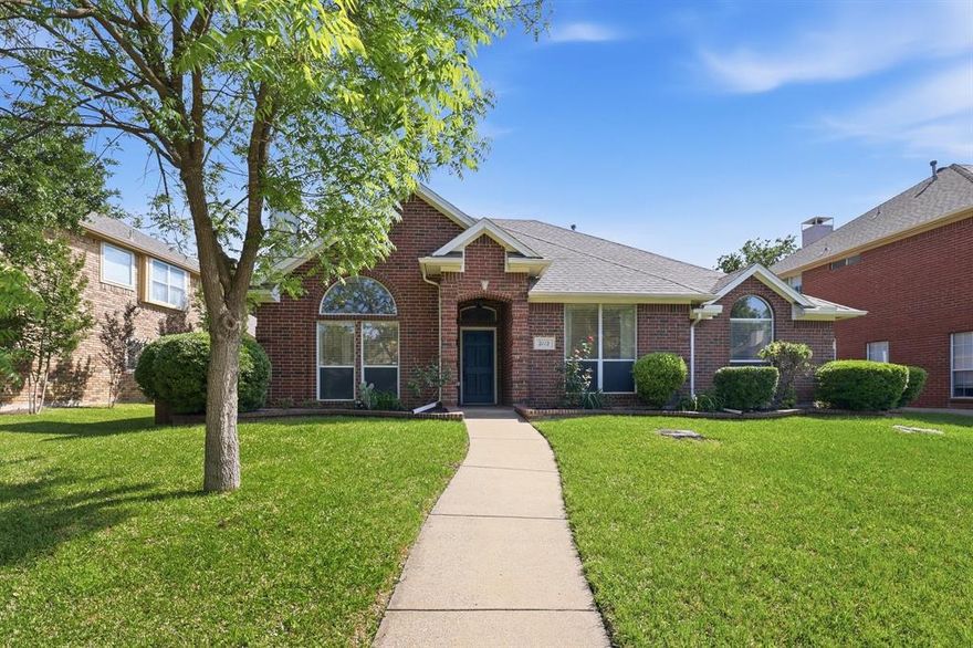 Welcome to this 3-bedroom, 2-bath home perfectly situated near Harvest Run Park, H-Mart, shopping and popular restaurants. As you walk through the front door, the living area greets you with a spacious floor plan with gorgeous hardwood flooring and a fireplace, creating a warm and versatile focal point. Off to the right are two bedrooms with a designated full bath. You will find large windows and plenty of space in the primary bedroom. The ensuite primary bath is equipped with a walk-in shower and double sinks. The kitchen features granite countertops, a gas cooktop, double ovens, and a breakfast nook.  The backyard has a covered porch and a fully fenced wood backyard, offering space for outdoor enjoyment and privacy. This is a well-rounded home that combines comfort and function.