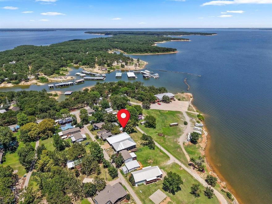 Welcome to where Waterfront Charm Meets Lake Life Living! This nearly new lakefront retreat offers panoramic water views from every window and its spacious wraparound porches. Whether you’re sipping coffee at sunrise or enjoying a sunset dinner, you’ll be surrounded by the sights and sounds of beautiful Lake Texoma.

Step inside to a move-in-ready cabin that’s perfect for weekend getaways or year-round living. Outfitted with a high-efficiency Nest-brand HVAC system, this cozy yet modern home brings comfort no matter the season.

Located in the vibrant American Legion golf cart community, enjoy amenities like clubhouse access, waterfront dining, and the local favorites: Taco Tuesdays and $6 Sunday breakfasts! Whether you’re boating, fishing, or just soaking it all in from your porch, this property delivers true lake life.

Please note: Buyer must be a current American Legion member or eligible to become one. Property is on leased land—sale includes improvements only.