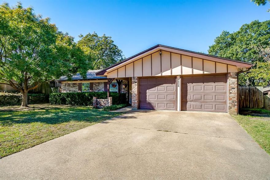 Nestled on a quiet, tree-lined street in a well-established Fort Worth neighborhood, this inviting 3-bedroom, 2-bath home combines timeless charm with thoughtful updates and plenty of space to make your own. Step inside to a bright, open living area anchored by a brick fireplace and built-in shelving — perfect for cozy evenings or relaxed gatherings. A skylight fills the space with natural light, while the adjacent kitchen offers ample cabinets, classic tile backsplash, and plenty of counter space for everyday cooking or weekend entertaining. The spacious sunroom just off the kitchen is ideal for a plant lover’s retreat, hobby room, or casual second living area — bringing the outdoors in with large windows overlooking the backyard. You’ll love the generously sized master bedroom, updated lighting throughout, and a thoughtful floor plan designed to give everyone plenty of room to relax and unwind. Out back, enjoy a fenced yard shaded by mature trees — perfect for pets, play, or weekend barbecues. Need a place for projects or extra storage? The 24x12 workshop with electricity is ready for your tools, hobbies, or creative ventures. Additional highlights include a two-car garage with ample driveway parking, established neighborhood with easy access to schools, shopping, and I-35W. Roof recently replaced. If you’re looking for a well-cared-for home with warmth, function, and bonus workspace, look no further!