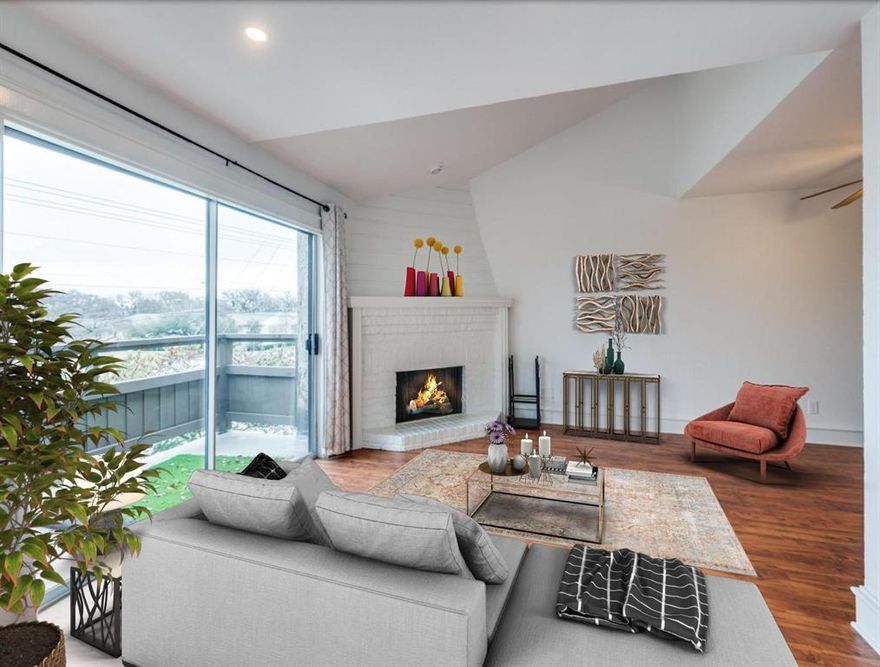 Updated condo in a prime location near SMU, Knox-Henderson, and Uptown! This stylish unit features beautiful wood flooring and a modern corner fireplace. The Kitchen includes a refrigerator and the breakfast bar that overlooks the Dining Room, perfect for easy entertaining. Enjoy your morning coffee on the private balcony or cozy up by the fireplace. Upstairs, the spacious Bedroom offers a full bath and large walk-in closet. Includes one assigned covered parking space directly beneath the unit and full-size washer and dryer for the tenant's convenience. The gated community offers multiple pools and a clubhouse, with shopping and dining within walking distance and White Rock Lake and Katy Trail just a short bike ride away!