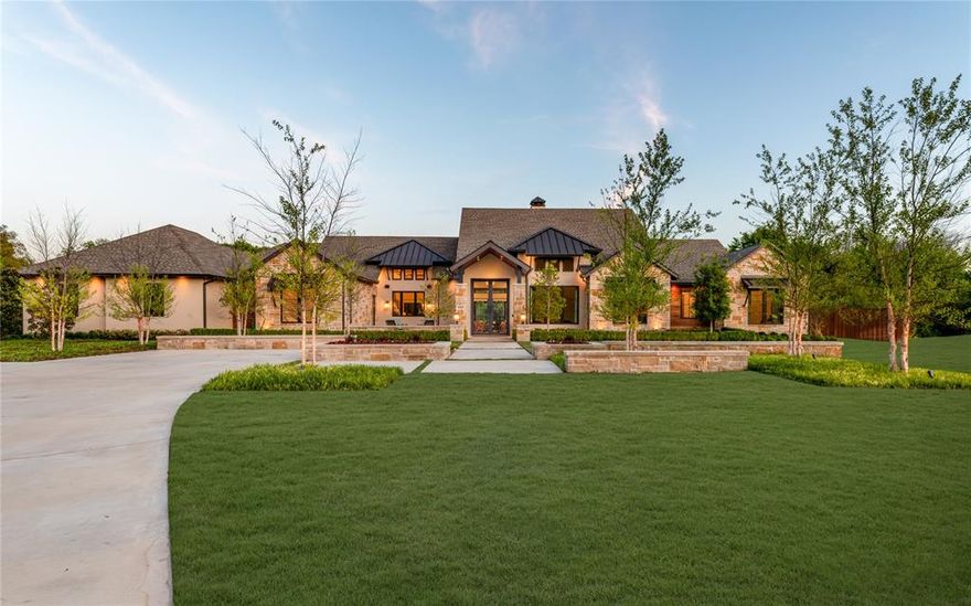 Tucked behind a secluded cul-de-sac in Stonebridge Ranch, this custom single-story estate by renowned builder GG Cain sits on a rare, fully treed acre lot where nature surrounds every corner and privacy is absolute. Inspired by the Texas Hill Country and finished to resort-level standards, this home has never been publicly offered for sale. There is nothing else like it in McKinney.

A private front courtyard with a tranquil fountain sets the tone upon arrival. Inside, soaring ceilings and walls of glass blur the line between interior living and the lush, mature landscape beyond, with every room intentionally positioned to capture the natural setting that surrounds it. The chef's kitchen is both a statement and a gathering place, featuring custom cabinetry, elevated finishes, a butler's pantry, and a designer-tiled built-in bar that is equal parts function and showpiece. A dedicated movie room, private office, and lodge-inspired flex living space complete an interior designed for deep comfort and effortless entertaining.

The primary suite is a world apart, a private wing with a spa-caliber bath, soaking tub, separate vanities, walk-in shower, and a custom closet. A private outdoor shower and dedicated yoga and relaxation garden extend the retreat beyond the walls of the home. Every additional bedroom is a fully ensuite suite, with a separate pool bath serving the outdoor living areas.

Outside, an infinity-edge pool anchors an experience that feels more private resort than residence. Professional landscaping, mature trees, and curated outdoor lighting create an atmosphere of serenity both day and night. A peaceful yoga garden, turfed dog run, and separate pet fencing ensure the grounds are as livable as they are breathtaking. Three-car garage and extended guest parking complete the picture. This is not just a home. It is an experience. A private retreat. A place that feels like a vacation every single day.