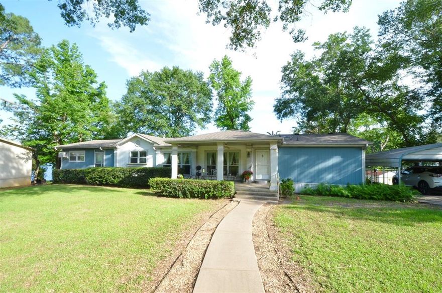 Waterfront home in Hickory Hills! Overlooking a spring fed lake this 3 bed, 2 bath property sits on 2 lots and features two inviting living areas, two dining spaces, and a sunporch ideal for morning coffee with tranquil water views. Step outside to enjoy a covered porch and deck, perfect for entertaining or unwinding after a day on the lake.Enjoy your private boat dock and pier perfect for fishing, boating, and relaxing. Small fenced area for pets, circle driveway for easy access, and access to community amenities including a pool. Ideal for full-time living or weekend getaways.