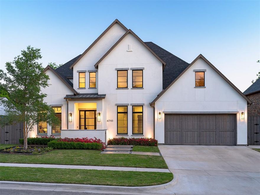 Nestled within the prestigious neighborhood of Preston Hollow, 6710 Northwood Road is an architectural masterpiece built by Thomas Signature Homes. Completed in 2022 the home consists of 5626 square feet, of a thoughtfully designed floor plan. With meticulous attention to detail this five bedroom, 5.2 bath is thoughtfully designed to include the primary on the main level, offering a serene retreat as well as a secondary bedroom. Three more bedrooms reside upstairs—alongside a game room, bonus room and media room—offer endless possibilities for entertainment and relaxation.Coupled with the home's luxurious amenities such as Subzero-Wolf appliances, Wolf Steamer Oven, open kitchen, and electric shades and Plantation Shutters, it beautifully exemplifies the beauty of new construction living. A dedicated study provides a tranquil workspace, and the exquisitely turfed backyard, complete with an outdoor living area beautifully provides an elevated living experience.