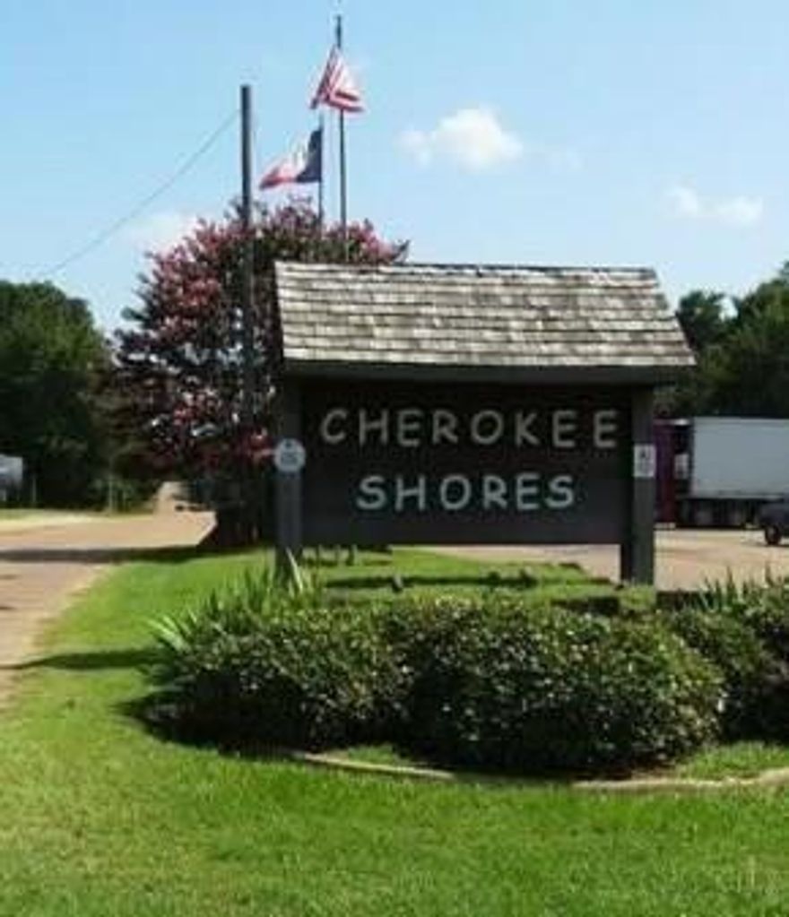 Nice, wooded lot near Cedar Creek Lake.  Ready for you to build on or you can put a manufactured or mobile home on the property. The lot is the 6th lot on the left after the big lot with the little RV on it.  The lot is from the fence poles that are on the left side of the lot, and down to the pink little strimmer on the right.  Nice lot with a lot of trees. Electricity and water are on site. Located in Cherokee Shore. The HOA offers a park, Club house, pool, 2 boat launches. This is an up-and-coming neighborhood with new construction. You can put a mobile home on the property. The restrictions are that the home must be 10 years old or less at the time of placement.  Permit must be obtained; buyers are encouraged to conduct their own due diligence to verify the utilities available and all other details.