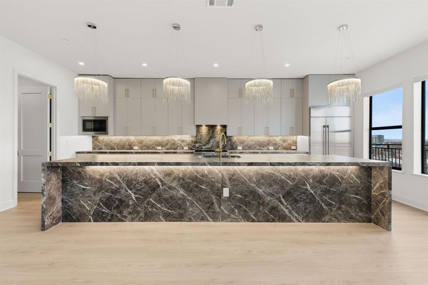 Welcome to Penthouse 608 at The Ruston, one of eight remaining exclusive penthouse residences and truly one of the crown jewels of this new-construction luxury condominium building on the edge of Downtown Dallas. Located in the vibrant Cedars neighborhood, this two-story, 3,062 SF, 2-bedroom, 2.5-bath penthouse offers unobstructed panoramic views of the Dallas skyline and an elevated standard of luxury living. Floor-to-ceiling windows illuminate expansive living spaces, showcasing soaring ceilings, a dramatic floor-to-ceiling fireplace, and an open layout ideal for refined entertaining. The chef’s kitchen features an oversized porcelain-slab island, side-by-side Monogram refrigerator, 6-burner Monogram gas range with pot filler, walk-in pantry, and a bar area with wet bar and wine cooler. Thoughtfully curated designer finishes and premium materials define every detail. Residents enjoy access to an exceptional suite of resort-style amenities, including a reflection pool, state-of-the-art fitness center, media room, wine room, game room, clubhouse, conference room, dog run with wash station, pickleball court, putting green, and outdoor lounge and grilling areas—delivering a truly elevated penthouse lifestyle in one of Dallas’ most dynamic neighborhoods.