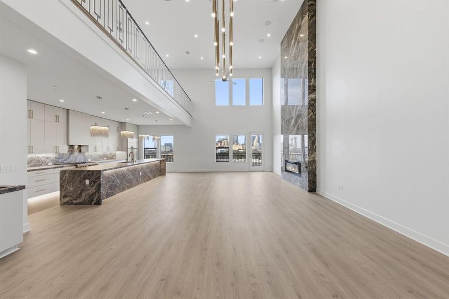 Welcome to Penthouse 608 at The Ruston, one of eight remaining exclusive penthouse residences and truly one of the crown jewels of this new-construction luxury condominium building on the edge of Downtown Dallas. Located in the vibrant Cedars neighborhood, this two-story, 3,062 SF, 2-bedroom, 2.5-bath penthouse offers unobstructed panoramic views of the Dallas skyline and an elevated standard of luxury living. Floor-to-ceiling windows illuminate expansive living spaces, showcasing soaring ceilings, a dramatic floor-to-ceiling fireplace, and an expansive private terrace with sweeping skyline views ideal for refined entertaining. The chef’s kitchen features an oversized porcelain-slab island, side-by-side Monogram refrigerator, 6-burner Monogram gas range with pot filler, walk-in pantry, and a bar area with wet bar and wine cooler. Thoughtfully curated designer finishes and premium materials define every detail. Residents enjoy access to an exceptional suite of resort-style amenities, including a reflection pool, state-of-the-art fitness center, media room, wine room, game room, clubhouse, conference room, dog run with wash station, pickleball court, putting green, and outdoor lounge and grilling areas—delivering a truly elevated penthouse lifestyle in one of Dallas’ most dynamic neighborhoods.