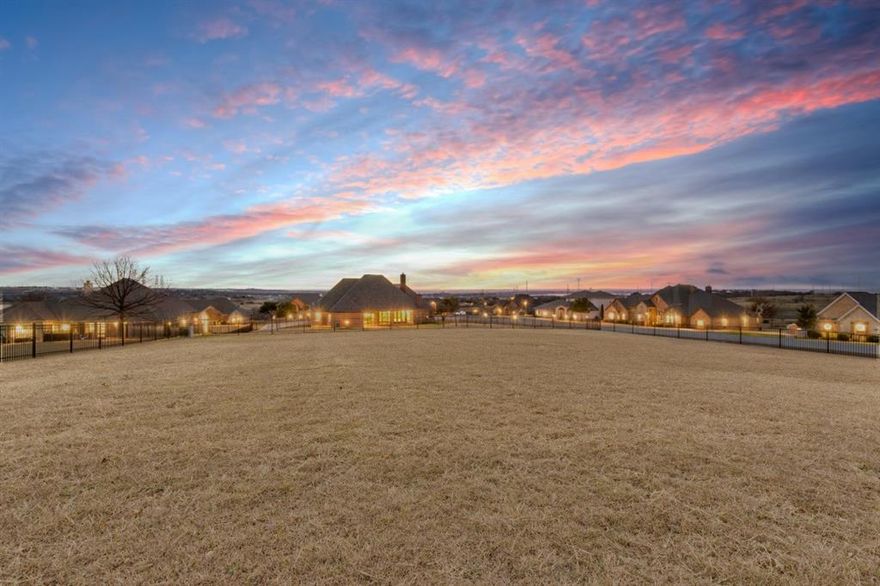 Lago Vista at Bonds Ranch -- Enjoy one of the most breathtaking views in Fort Worth! Perched on a hillside overlooking Eagle Mountain Lake and the rolling Fort Worth landscape, this stunning single-story home is located in a gated community featuring a pool, park, playground, and serene ponds. The kitchen offers granite countertops, a walk-in pantry, and abundant storage. Two dining areas include a formal dining room with dual built-in hutches. A secondary living area features a built-in desk, perfect for a home office or study space.


The home boasts a split-bedroom layout, soaring ceilings in the main living area, and a spacious open entry hall. The primary suite is generously sized, with large windows showcasing the beautiful backyard and sweeping views. The en-suite bath includes a relaxing garden tub and separate shower. Two additional bedrooms are situated on the opposite side of the home near the oversized three-car garage. Covered front and back porches provide ideal spaces to enjoy the scenery. Conveniently located just 30 minutes from downtown Fort Worth.