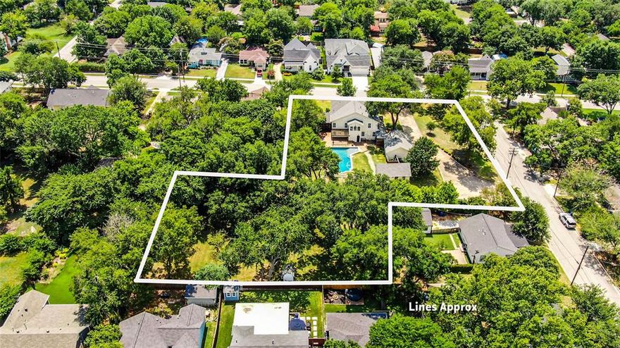 Imagine calling 1102 W. Howell Street home—a majestic Colonial Revival in the heart of Historic Downtown McKinney that blends timeless heritage with modern luxury. Situated on a lavish 1.3-acre double lot, this fully renovated 1914 property features over 4,700 sq ft of living space, five bedrooms, and four-and-a-half baths. Between the rich original oak floors, bay windows, and character-defining details like glass door knobs and a vintage brass doorbell, it's clear this isn't just a house—it’s a piece of McKinney history. Living here would feel like your own private retreat: enjoy an updated chef’s kitchen, a gas-fireplaced primary suite with walk-in closets, a separate carriage house accessory unit above a spacious workshop, and an elegant saltwater pool with a cedar deck, pergola, orchard, and even a treehouse with a zip line in the backyard oasis. Add to that a circular driveway and oversized two-car garage big enough for a full-size pickup and that's urban living at its finest—yet surrounded by leafy privacy and charm.