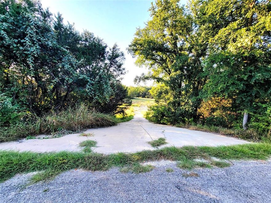 BEAUTIFUL LAND IN GRANBURY. This property is ready to built with survey available.  It is 5.1 acres in a peaceful area. This property is so unique and it has a concrete driveway. A very nice Concrete-Stone like natural creek you will love. Fence and gate all around. Please go and show. If you have any questions please let me know.