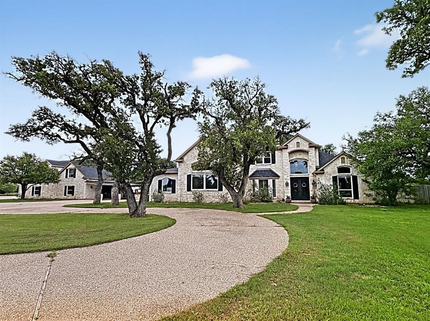 Stunning 15.217-acre estate offering luxury living, exceptional privacy, and endless possibilities. The main home features 4BR,2.5BA 3660.5 sq ft per MCAD and guest home features 3BR, 2BA at 1730 sq ft per MCAD.

This beautifully designed 4 bedroom, 2.5 bath home features an open floorplan with a gourmet kitchen showcasing an oversized island, Sub-Zero refrigeration, wine fridge, expansive granite countertops, and abundant cabinetry. Enjoy two dining areas, a huge walk-in pantry, storage room, and a spacious mudroom with sink and half bath. The kitchen and dining spaces flow seamlessly into the inviting living area, highlighted by walls of windows and a majestic fireplace that anchors the room.

The primary suite is a serene retreat with private access to an enclosed patio—perfect for morning coffee. The spa-inspired bath includes a luxurious soaking tub, oversized walk-in shower, and a laundry closet for a stackable washer-dryer. A massive walk-in closet features floor-to-ceiling built-ins for exceptional storage.

A separate 2-bedroom, 2-bath guest house offers incredible flexibility, complete with a 3-car garage, upstairs living area, and a large downstairs entertainment room. Accordion doors open the space to the oversized outdoor kitchen and inground diving pool, creating the ultimate indoor-outdoor experience.

Outdoor living shines with a large diving pool, pool cabana and outdoor kitchen, and expansive patio areas ideal for entertaining. The property also includes two huge workshops, one insulated and designed to double as an entertainment venue, plus ample room for equipment storage.

Beautifully wooded acreage provides space for livestock, recreation, or simply enjoying the peaceful natural surroundings. This property is a rare blend of luxury, functionality, and Texas countryside beauty.

Some photos have been enhanced and-or staged with AI.