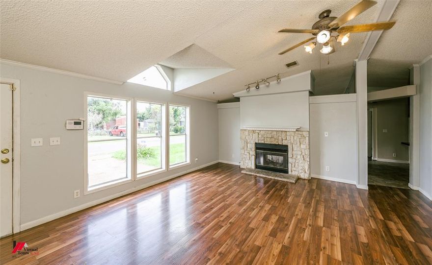 Recently updated 4 Bedroom home with an additional Office that could work as a 5th Bedroom, plus 2 separate Living areas and a double sided Fireplace, on a Corner Lot!  New carpet & vinyl flooring.  10+ foot ceilings in Living Room & Den! Large Deck in back with huge shade trees, perfect for grilling and entertaining!  Fresh Paint throughout!  Priced to Sell, As is, with no repairs.