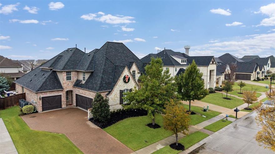 Gorgeous Huntington home located in the master planned community of Lightfarms in Celina - Prosper ISD.
This property sits directly on Parkview Boulevard, one of the most desirable streets in the neighborhood. It offers an open floorplan that is perfect for entertaining and daily living, with extensive upgrades throughout including a Wolf range, built in refrigerator, custom wood paneling, and a beautifully designed master closet.

Inside you will find a stately Huntington layout with executive level finishes. The raised study features judges paneling, sconce lighting, a beamed ceiling, and custom bookcases. The chef inspired kitchen includes commercial grade Wolf appliances, a Bosch dishwasher, a SubZero refrigerator, stunning granite, and a massive island with a farm sink overlooking the family room with its vaulted beamed ceiling and impressive stone fireplace.
The elegant master suite offers a spa inspired bath with a garden tub, oversized shower with a rain showerhead, and a custom closet. All bedrooms include ensuite baths, and there is a full guest suite on the main floor.

Upstairs features three bedrooms, a built in desk and craft area, a spacious game room, a large wet bar with a beverage fridge and microwave, and a fully equipped media room.

The backyard paradise includes a sparkling pool and spa with fire and water features, a travertine patio, turf yard, and a custom cedar cabana with a gas grill, Memphis smoker, flat screen TV, and refrigerator. Designed for privacy and year round enjoyment.

Located in Prosper ISD with unmatched curb appeal and luxury, this home delivers the full lifestyle experience in Light Farms.

Welcome home.