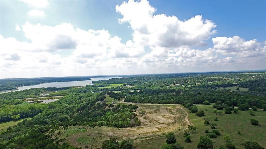Investing in this property presents a unique opportunity for real estate investors. With its prime location just 5 minutes from downtown Weatherford and 20 minutes from Fort Worth, it offers both convenience and potential for development. The incredible views of Lake Weatherford, coupled with the nice diversity of trees and the 140' elevation change, make it an attractive prospect for various development projects. Whether it's a luxury residential community, a commercial development, or even a recreational getaway, the property's features and accessibility make it an excellent investment opportunity. Additionally, the availability of water well and electric utilities further enhances its potential for development, making it an ideal choice for those looking to invest in real estate with long-term growth and profitability in mind.