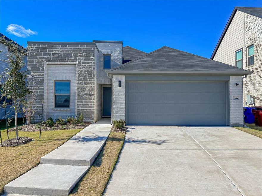 Enter modern luxury in this Trophy Signature Homes creation, a contemporary haven with a facade marrying gray stone and white brick. Luxury vinyl plank flooring sets the stage for an open concept adorned with built-in desks and a practical mudroom. Innovations include a sprinkler system, tankless water heater, and LED disc lighting. A linear gas fireplace adds warmth, while the kitchen boasts quartz countertops and a subway tile backsplash. Dual vanities grace the primary bath, accompanied by an oversized walk-in closet. Secondary bedrooms offer ample space, and a covered patio extends living outdoors. Built with precision by Trophy Signature Homes, this brand-new residence invites you to be the first to experience its blend of style and innovation. Welcome to contemporary elegance and functional design, where every detail reflects the craftsmanship of Trophy Signature Homes.